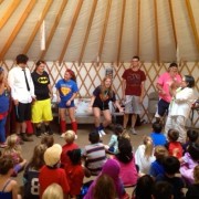 Camp Terry counselors doing "Lion Pose" yoga with Janet Wong